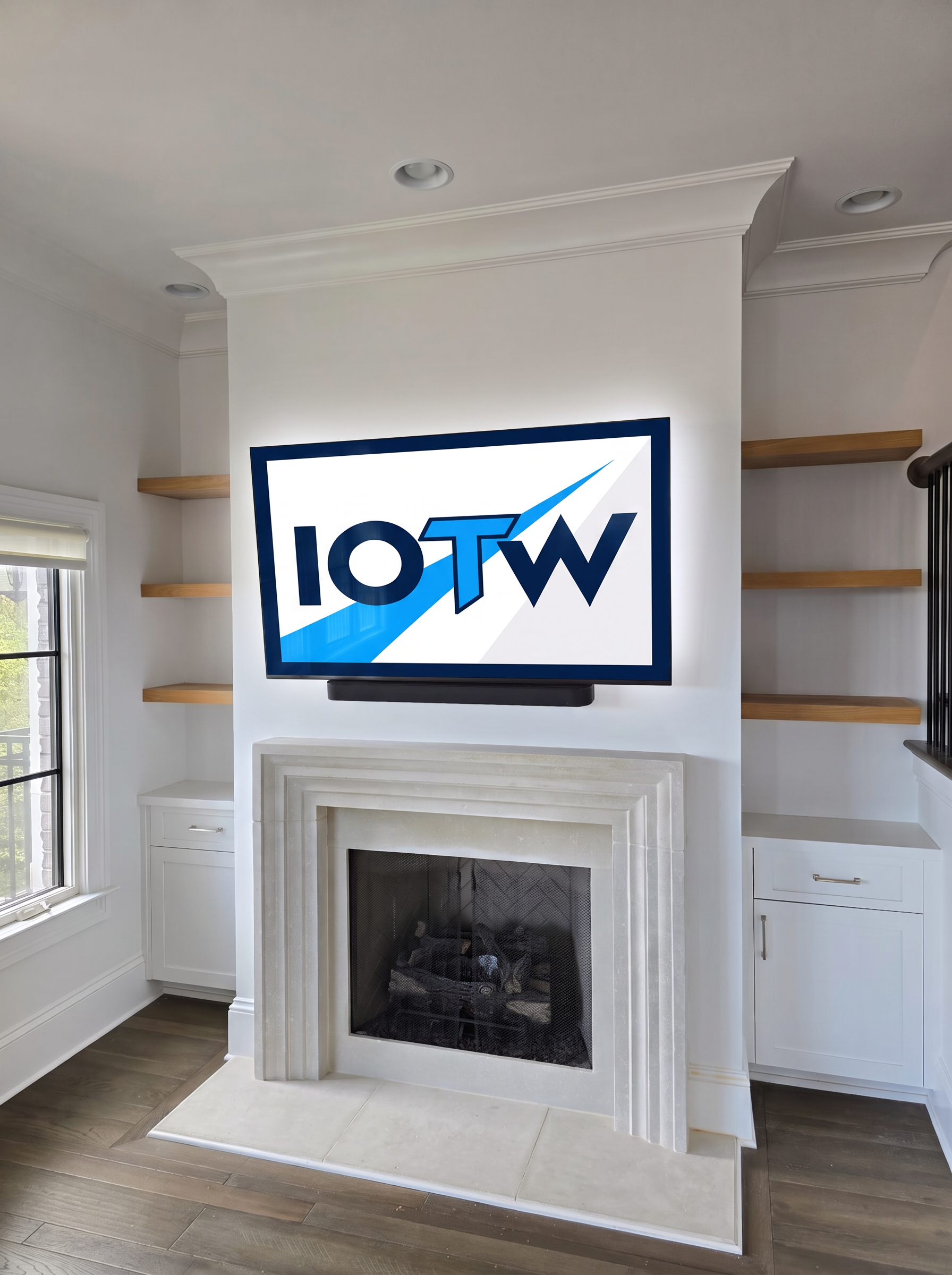 Large TV mounted above a white stone fireplace with a soundbar below
